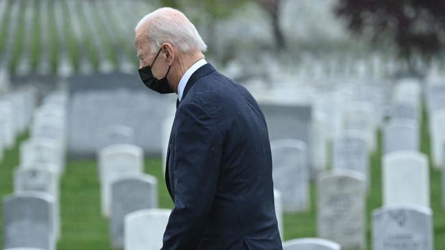 US President Joe Biden walks through Arlington National cemetary to honor fallen veterans of the Afghan conflict last month. Picture: AFP