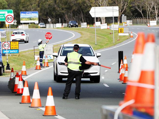 Police check people at the NSW-Qld border. Picture: Nigel Hallett