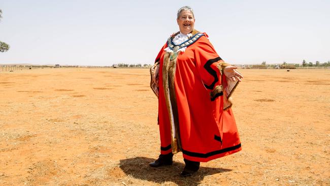 Petersborough Mayor Ruth Wittle in a field where trucks are dropping off bales of hay. Picture: AAP Image/ Morgan Sette