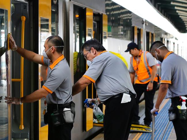 Cleaning crews wipe down and disinfect trains at Central railway station. Picture: Gaye Gerard