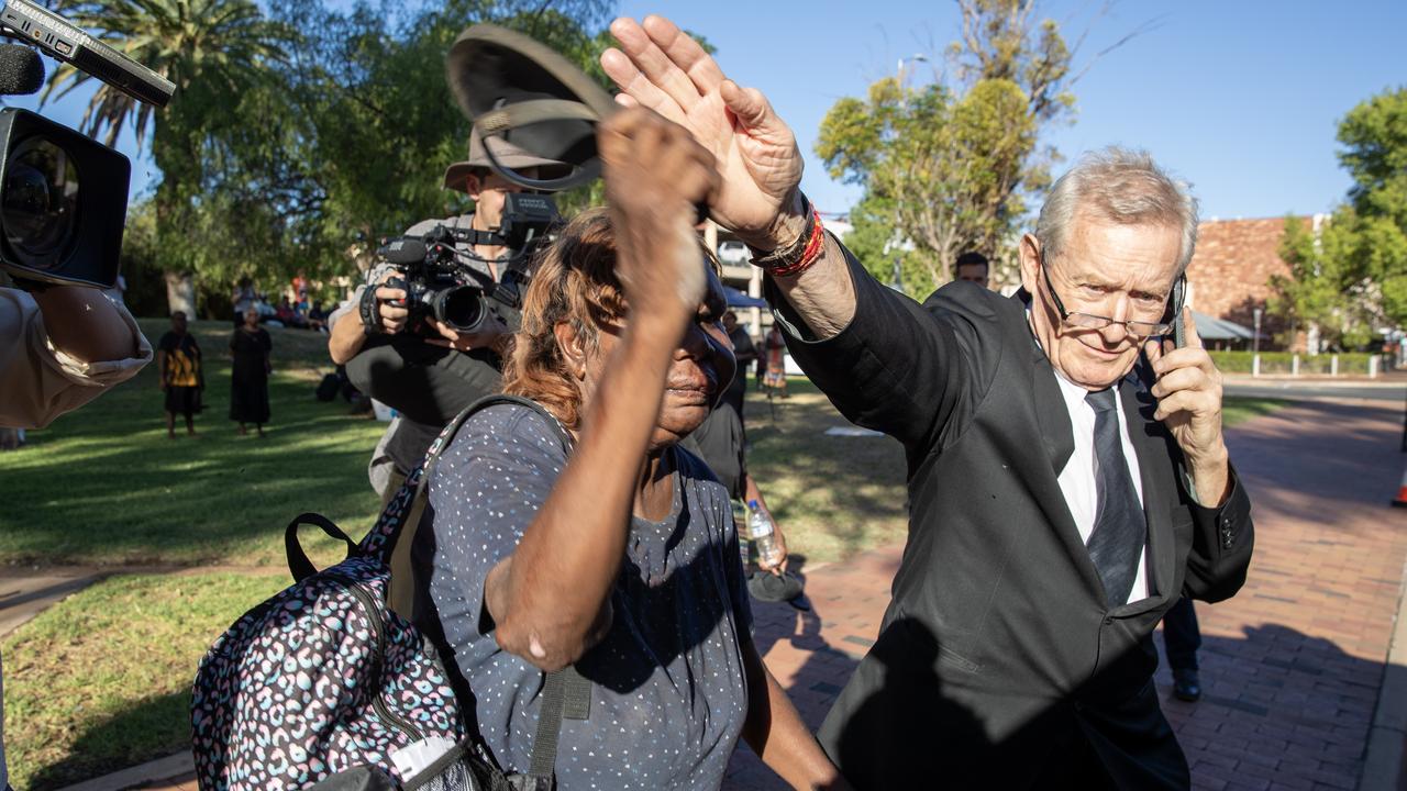 Michael Abbott KC dodges protestors outside court on Monday. Picture: Liam Mendes