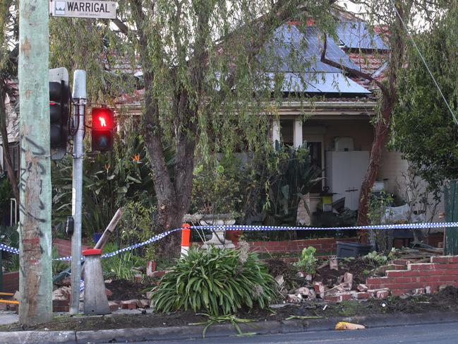 MELBOURNE, AUSTRALIA - NewsWire Photos - 03 JULY, 2024: A driver has been killed in a collision with a stolen car in Burwood. Damage to the front fence of a house that one of the cars crashed through. Wednesday, July 3, 2024. Picture: NewsWire / David Crosling