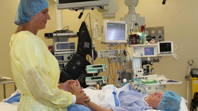 Yvonne Demaagd comforts her daughter Nickola McNabb before her surgery. Picture: Mandy Lake 