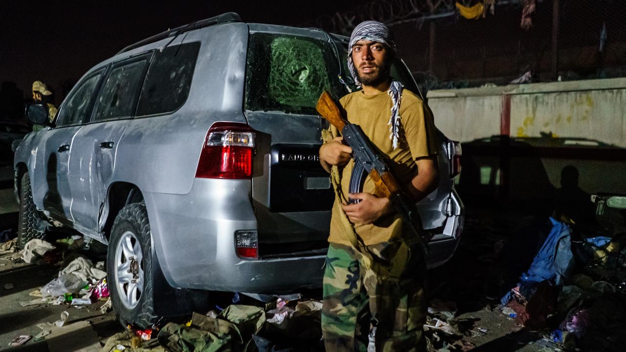 A Taliban fighter guards a checkpoint outside the airport in Kabul, Afghanistan. Picture: LA Times