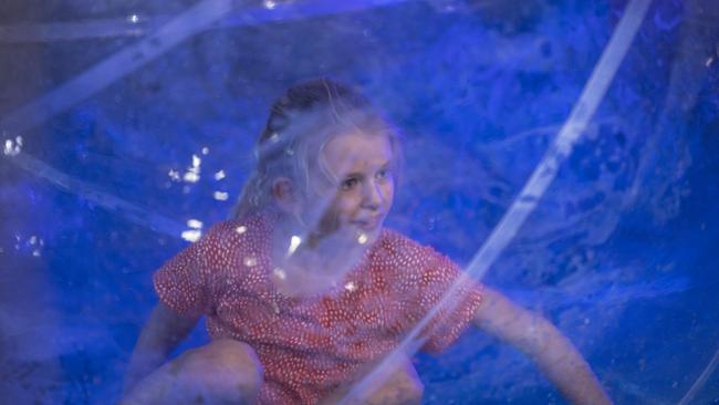 Matilda Bill in a water walking ball in sideshow alley at the Toowoomba Royal Show, Thursday, March 30, 2023. Picture: Kevin Farmer