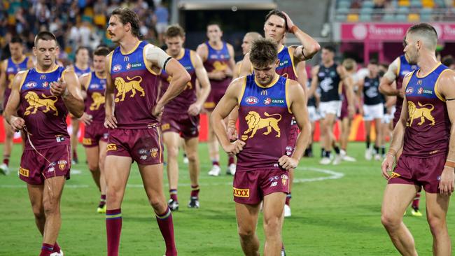 BRISBANE, AUSTRALIA - MARCH 08: Brisbane Lions are seen leaving the field after the 2024 AFL Opening Round match between the Brisbane Lions and the Carlton Blues at The Gabba on March 08, 2024 in Brisbane, Australia. (Photo by Russell Freeman/AFL Photos via Getty Images)