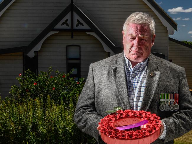 Maclean RSL Sub-Branch president Steve Walton with a wreath at the scaled-back Remembrance Day ceremony in Maclean. Photo: Adam Hourigan