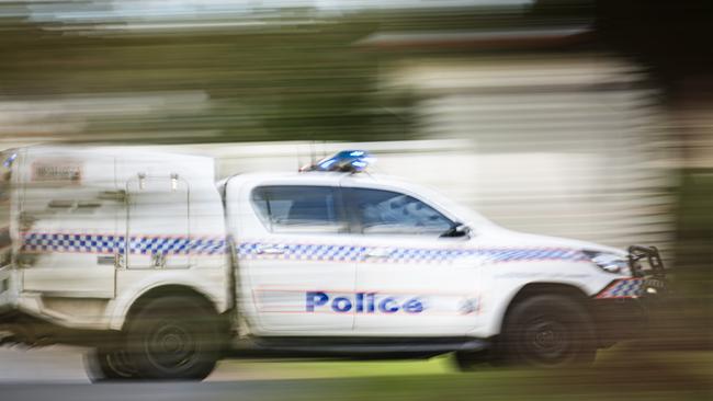 A police vehicle under lights and sirens. Picture: Kevin Farmer
