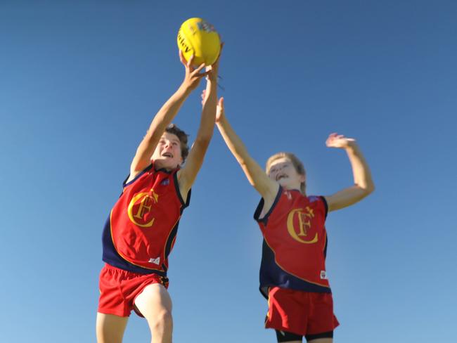 SANFL is calling out to boys across the state to join up to a local footy club with registrations down on pre-Covid. Some clubs, such as Flinders Park are bucking the trend and looking pretty solid, with coach Paul Amato and his boys, Jack,14, and Declan,12, looking forward to a successful season. 25 March2022. Picture Dean Martin