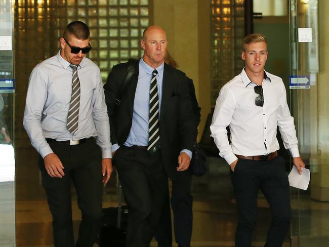 Chad Sharp (left) and Josh Hudson (right) leave Downing Centre Local Court with their lawyer Peter Strain after (right) after being found guilty. Picture: Richard Dobson