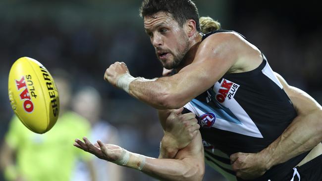 Travis Boak fires out a handpass against Fremantle. Picture: Sarah Reed