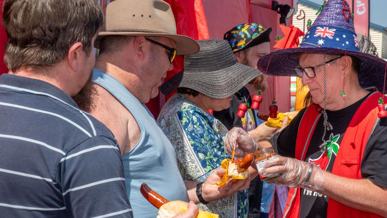 Wayne Marsh serves out the hot sauce at the Murphys Creek Chilli and Craft carnival. Sunday, September 22, 2024. Picture: Nev Madsen