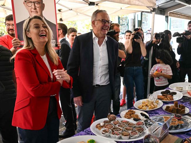 Australia's Prime Minister Anthony Albanese and his partner Jodie Haydon arrive to vote in the general election at a polling station in a primary school in the suburb of Marrickville in Sydney on May 3, 2025. (Photo by Saeed KHAN / AFP)