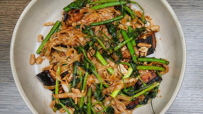 The wok-fried noodles with pork belly and crushed peanuts.