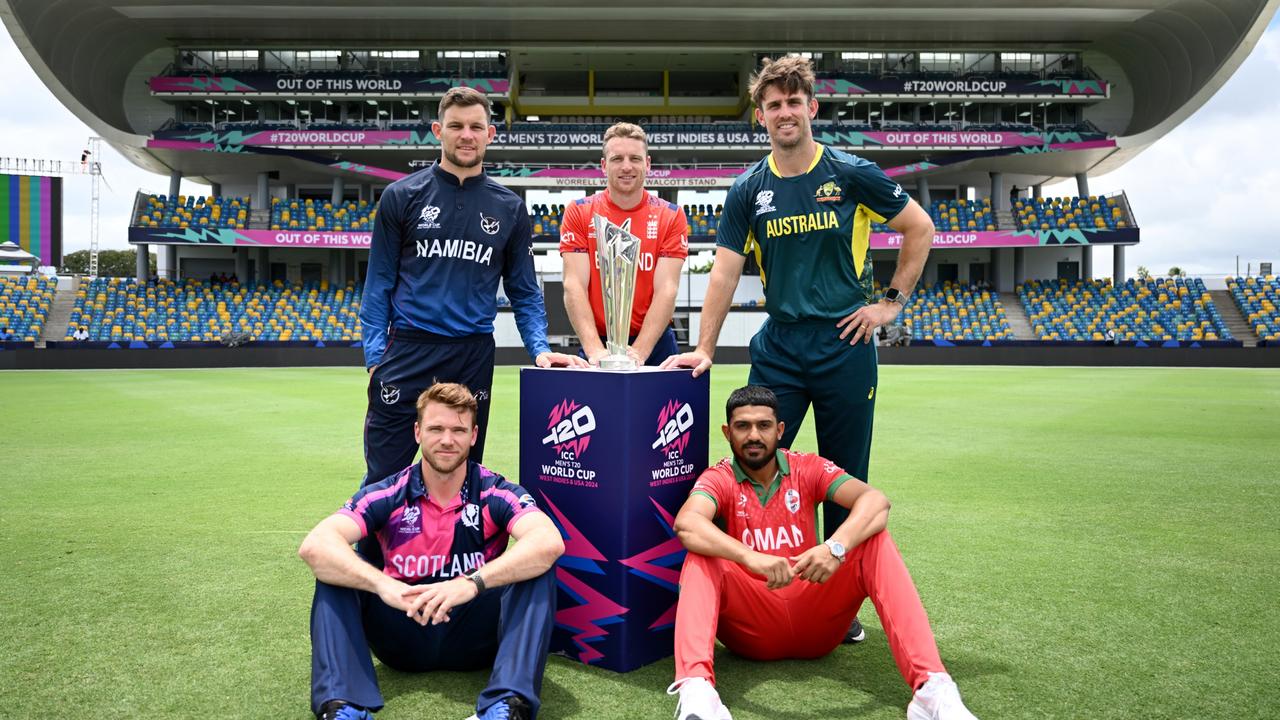 Richie Berrington of Scotland, Gerhard Erasmus of Namibia, Jos Buttler of England, Mitchell Marsh of Australia and Aqib Ilyas of Oman. Photo by Gareth Copley/Getty Images