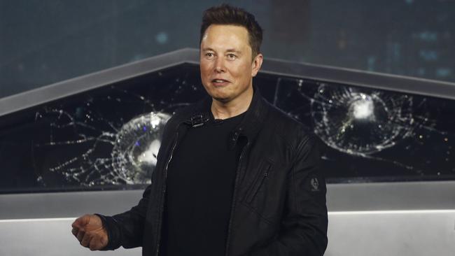 Elon Musk with the Cybertruck window. The much-hyped unveil of Tesla’s electric utility went off script when supposedly unbreakable glass shattered twice when hit with a large metal ball. Picture: AP