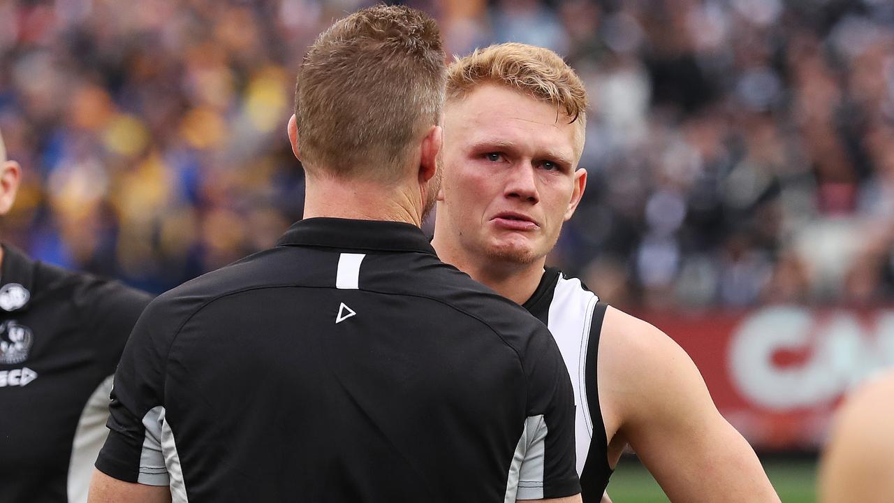 An emotional Adam Treloar chats with Nathan Buckley after the 2018 Grand Final. Photo: Phil Hillyard