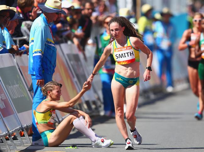 Beki Smith of Australia consols Claire Tallent after she is given a red card.