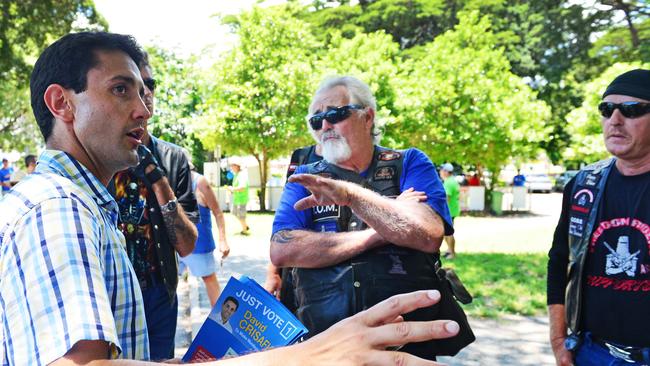 Mundingburra MP David Crisafulli is confronted by members of the Freedom Riders Association Queensland while handing out how-to-vote cards at Mundingburra State School. Picture: Zak Simmonds