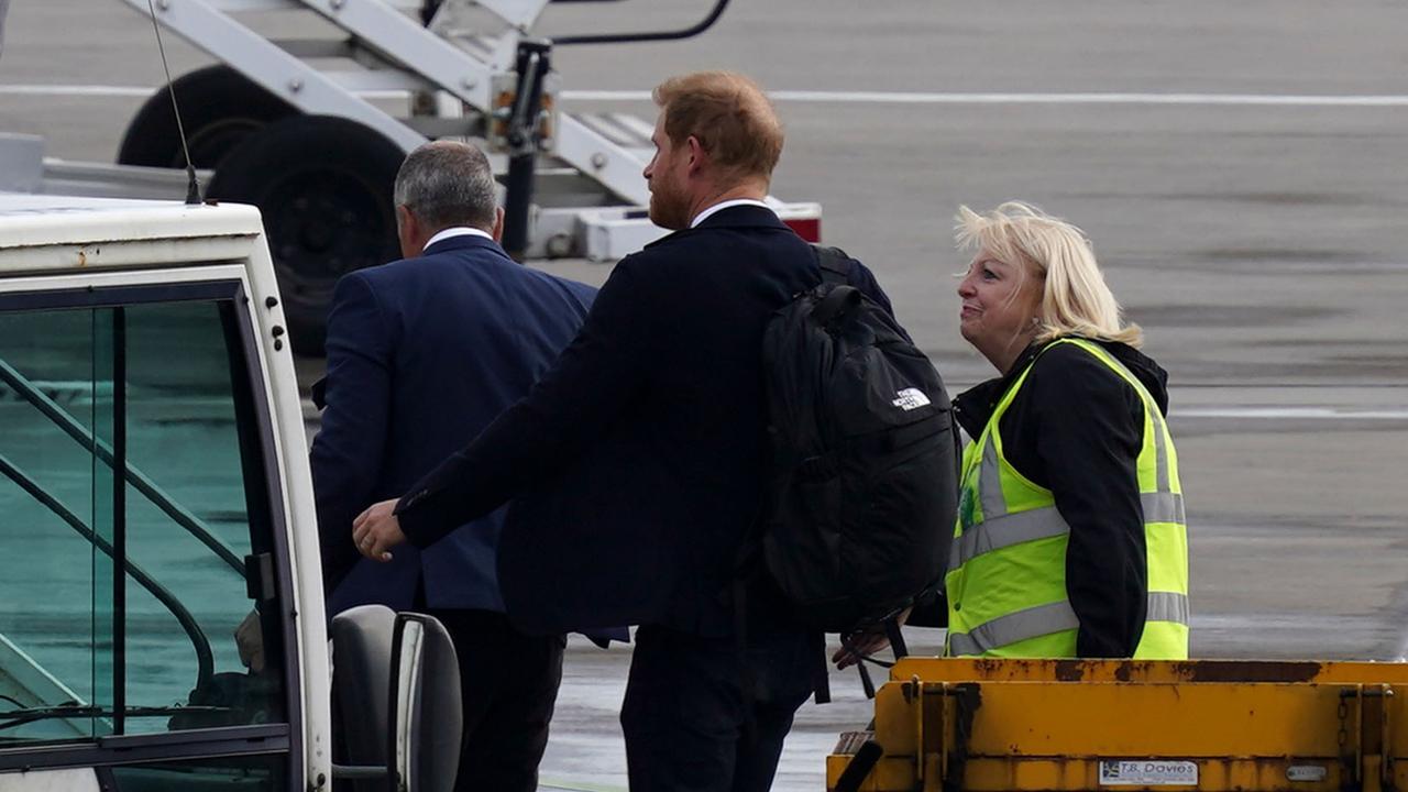 Prince Harry boards a flight at Aberdeen Airport. Picture: Peter Summers/Getty Images