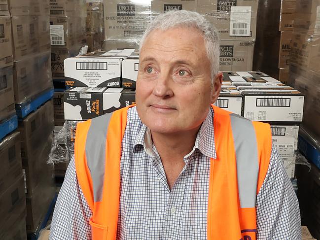 Big V Interview. David McNamara CEO of Foodbank in Victoria. David McNamara CEO with donated food stocks in the warehouse.                  Picture: David Caird