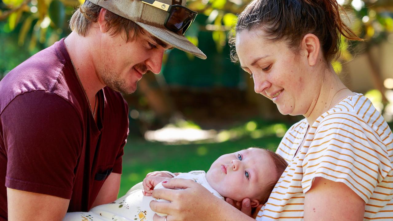 Jessie Evans and Billy Blacker with their son Rocka, 4 months, in Double Bay. The Western Downs family traveled to NSW for medical treatment for Rocka. Now they are having trouble getting back home. Picture: Justin Lloyd.