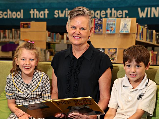 Heather Clemens reading to year two students Chole Veness and Tomas Field at Middle Harbour Public School. Picture: AAP IMAGE / Adam Yip