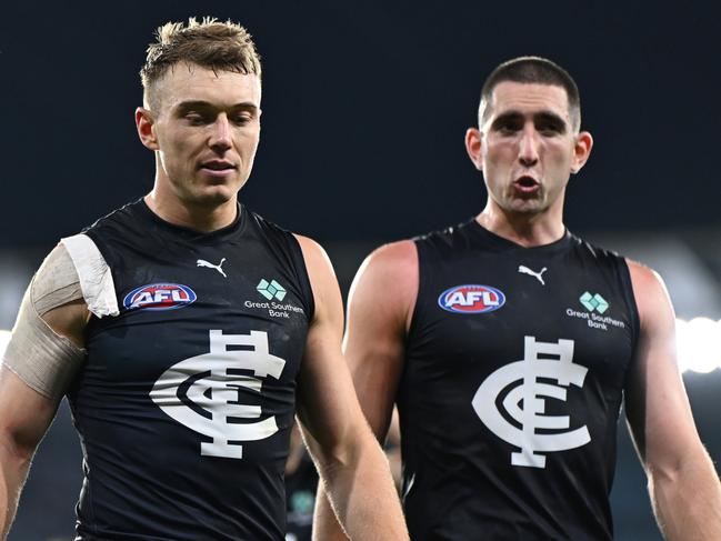 MELBOURNE, AUSTRALIA - APRIL 27: Patrick Cripps and Jacob Weitering of the Blues look dejected after losing the round seven AFL match between Geelong Cats and Carlton Blues at Melbourne Cricket Ground, on April 27, 2024, in Melbourne, Australia. (Photo by Quinn Rooney/Getty Images)