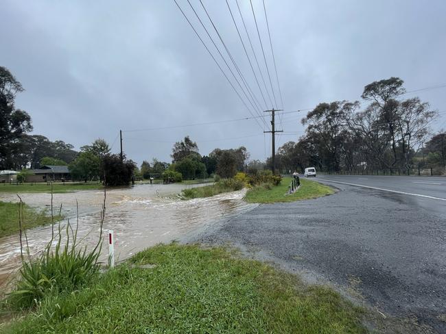 Flood waters are getting close to the Calder Freeway south of Bendigo as heavy downpours continue on October 13, 2022. Picture: Hayley Elg