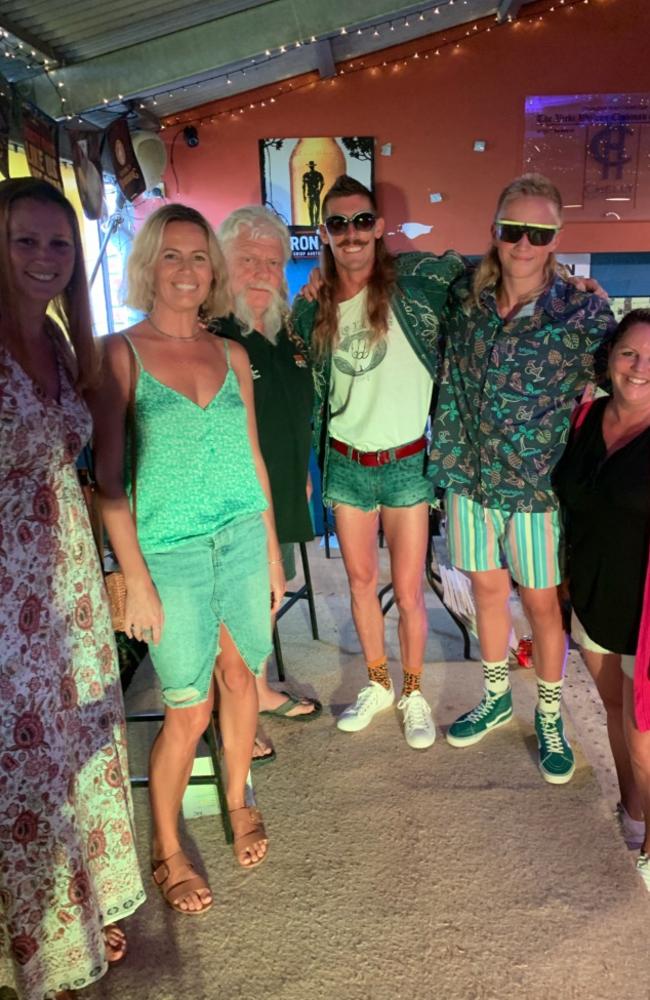 Friends Jessica Ambrose (left), Erin Campbell (second left) and Alicia Phillis (right) with competitors at the 2019 Mulletfest.
