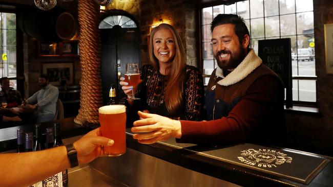 Friends Paris Granger and Ben McCallum share a drink at the Lord Nelson pub in The Rocks, Sydney, on Friday. Picture: Nikki Short