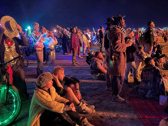 Attendees gather to watch the burning of "The Chapel of Babel," a work of art by Michael Burlington, during the annual Burning Man Festival in the early morning of September 5. Picture: AFP