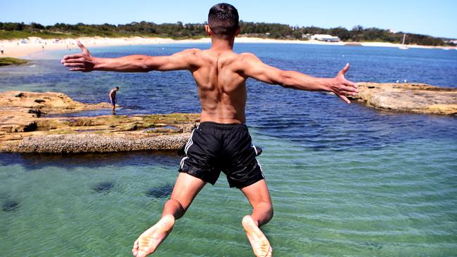 Spring into summer: Jehad Dabel takes the plunge at Yarra Bay earlier this week. Picture: Chris Pavlich