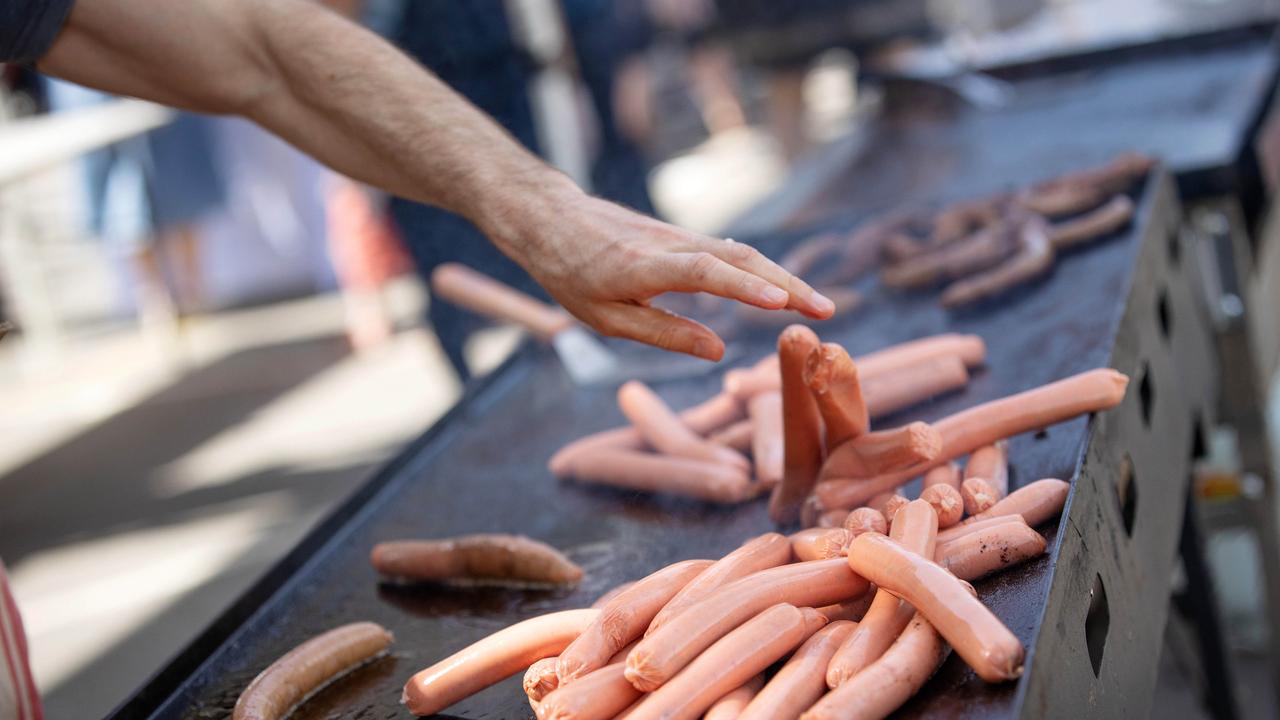 Democracy sausages have been a hallmark of Australian Federal and State elections. Picture: Mark Stewart