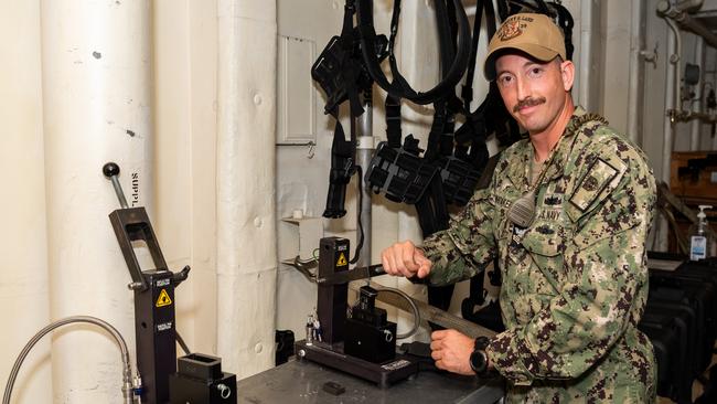 Refilling cartridges with compressed air in the simulation gun range. Picture: Pema Tamang Pakhrin