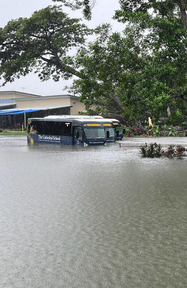 Some of the Cathedral School buses in the flooded carpark, March 19, 2025