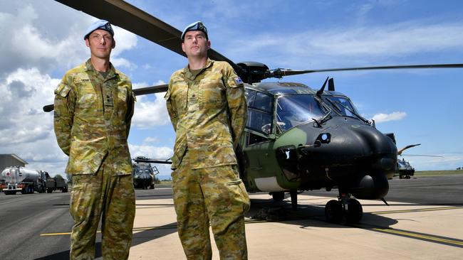 Defence personnel from Townsville-based 5th Aviation Regiment prepare to deploy from RAAF Base Townsville on Operation Flood Assist 23-1 to north-west WA. Commanding officer 5th Aviation Regiment Lieutenant Colonel Andrew Lean and deployment commander Major Jeremy Costello in of MRH90 Taipan helicopters preparing to deploy. Picture: Evan Morgan