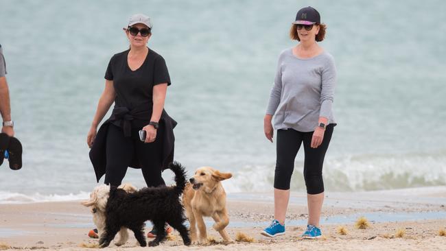 Julia Gillard, right, on Brighton beach this week with a friend. Picture:  Mega