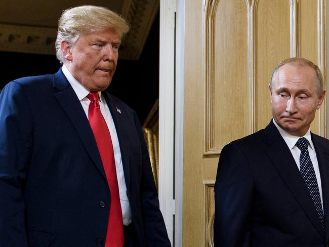 (FILES) US President Donald Trump (L) and Russian President Vladimir Putin arrive for a meeting in Helsinki, on July 16, 2018. Putin told his US counterpart Donald Trump in a phone call on February 12, 2025 that "peaceful negotiations" on ending the Ukraine conflict were possible, the Kremlin said. "President Putin ... agreed with Trump that a long-term settlement could be reached through peaceful negotiations," the Kremlin said in its readout of the call, which it said lasted almost one-and-a-half hours. (Photo by Brendan Smialowski / AFP)