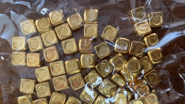 A haul of gold ingots cannabis-growing parents gave to their daughter before they were seized by the NSW Crime Commission.