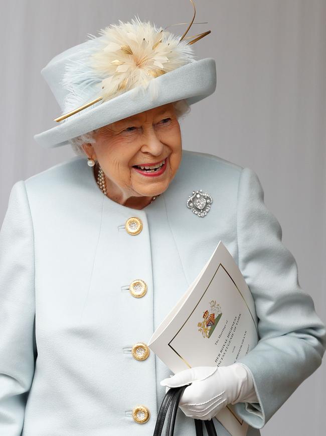 Britain's Queen Elizabeth II waits for the carriage carrying Princess Eugenie of York and her husband Jack Brooksbank to pass. Picture: AFP