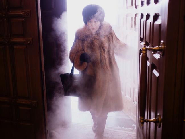 A local woman enters Preobrazhensky Cathedral in a swirl of freezing mist Yakutsk. Picture: Amos Chapple/REX/Shutterstock/Australscope