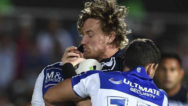 The Bulldogs defence halts the progress of Cowboys forward Coen Hess. Picture: Getty Images