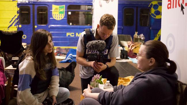 Natalie Vikhrov, left, reporting from a metro station in Kharkiv in 2022. Picture: Tom Mutch