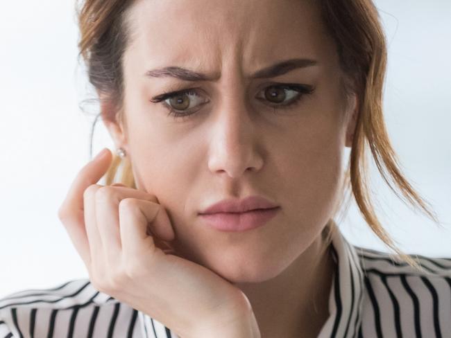 Confused businesswoman annoyed by online problem, spam email or fake internet news looking at laptop, female office worker feeling shocked about stuck computer, bewildered by scam message or virus