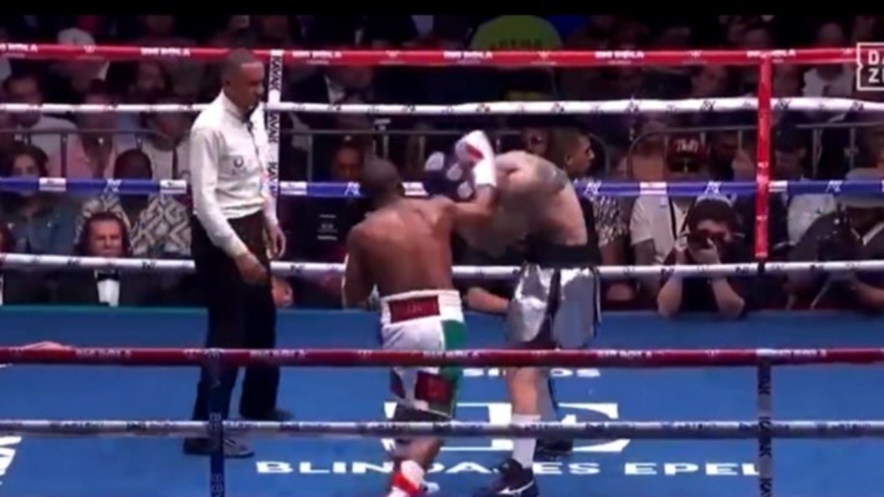 The boxing icon was penalised for this hook to the head. Photo: DAZN