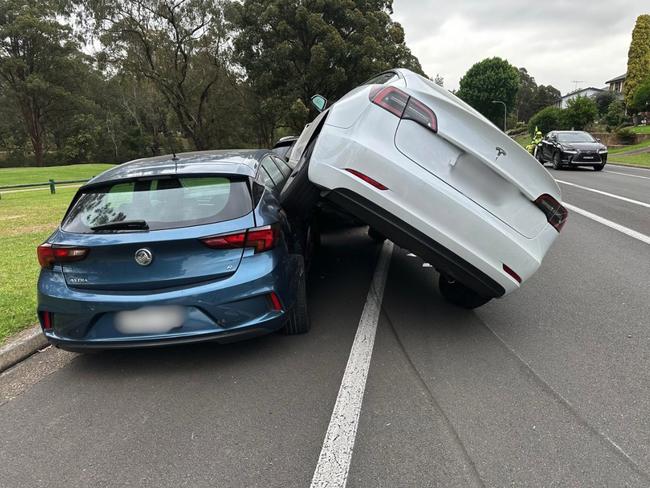 A recovery operation has taken place after a Tesla mounted another car. Picture: The Hills Police Area Command