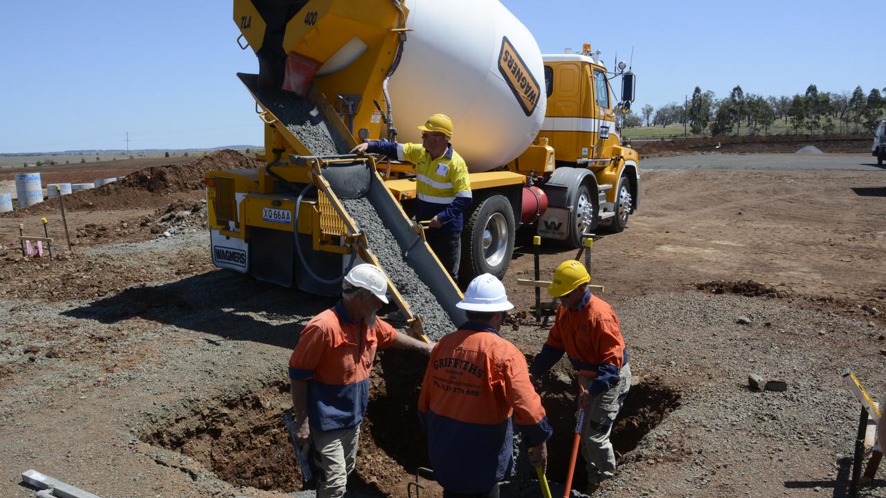 The first concrete is poured at the construction site of the Toowoomba quarantine hub, which will be up and running with 500 beds by Christmas 2021. Photo: Jarrard Potter.