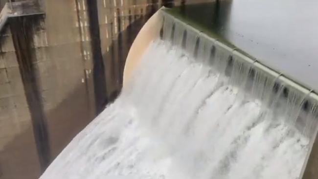 Water gushes from Warragamba Dam on Sunday. Picture: Water NSW