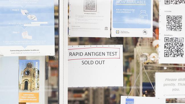 A sign on the front door a pharmacy tells the tale of difficulty for members of the public to secure Rapid Antigen Tests. Picture: NCA NewsWire/Dylan Robinson